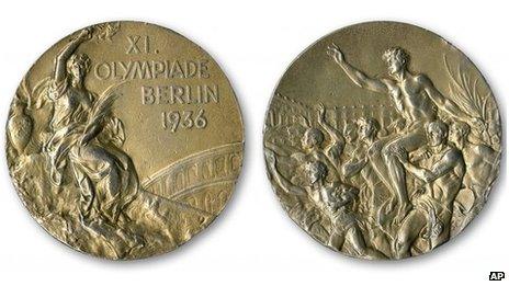 This handout provided by SCP Auctions, Inc shows the front, left, and back, right, of one of Jesse Owens four gold medals won at the 1936 Olympics in Berlin