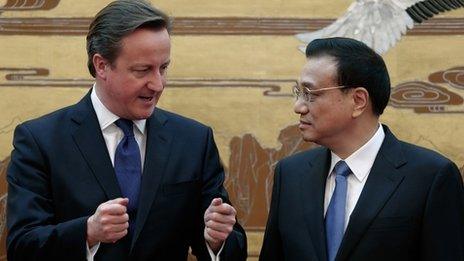 British Prime Minister David Cameron (L) talks with Chinese Premier Li Keqiang (R) during the signing ceremony at the Great Hall of the People on December 2, 2013 in Beijing, China.