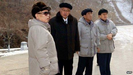 This undated file picture released by North Korea's official Korean Central News Agency (KCNA) on 18 January 2009 shows North Korean leader Kim Jong-Il (L) inspecting the Mt Ryongak Recreation Ground in Pyongyang with Chang Song-thaek (R)