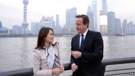 David Cameron talks to Lisa Pan, vice-president of games manufacturer Rekoo, in Shanghai