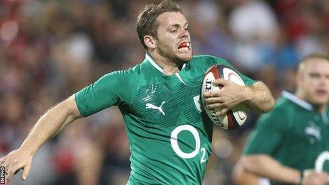 Dave Cave runs in to score a try for Ireland against Canada in June