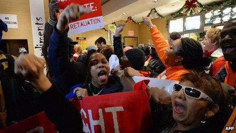 Demonstrators inside a McDonald's near New York's Times Square on 5 December 2013