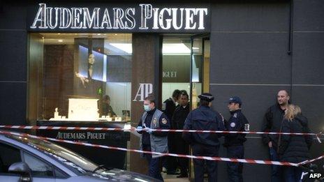 Forensic policemen are seen working in a jewellery store that was attacked in Paris