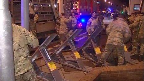 The Light Dragoons erecting flood defences in Great Yarmouth