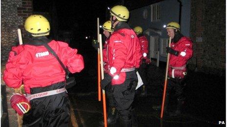 Firefighters carried out house-to-house checks in Blakeney, Norfolk, overnight