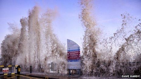 Picture taken at the seafront in Cleethorpes as waves hit (smash against) the seafront during stormy weather