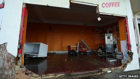 Damaged buildings and debris on the promenade on December 6, 2013 in Cromer, England