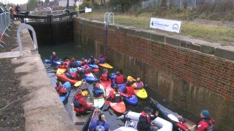 A group of kayakers move into Dudbridge Upper Lock, Stroud