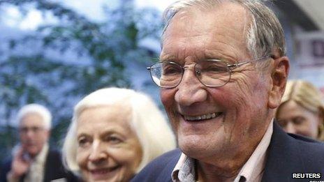 Merrill Newman smiles after being reunited with his wife, Alicia, at San Francisco International Airport.