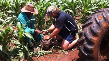 A farmer (R) and farm worker (L) on a farm in VEtersdorp