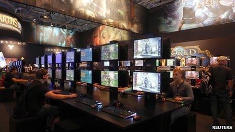 Visitors play World of Warcraft in Cologne, Germany on 21 August 2013