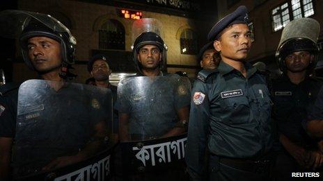 Police stand guard in front of the gate of Dhaka Central Jail.