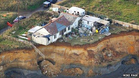 Ms Neirop-Reading's home on the cliff after December tidal surge 2013