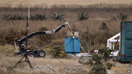 A robotic arm recovers radioactive cobalt-60 and deposits it in a safe container in a field in central Mexico on 10 December, 2013