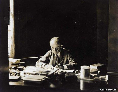 JM Barrie at his desk in his Adelphi Terrace House