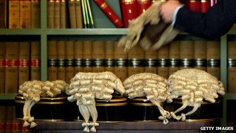 A barrister picks up his wig