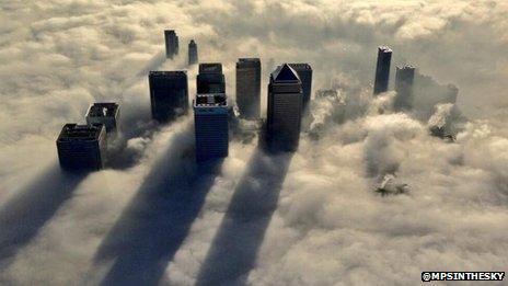 Canary Wharf in fog, photographed by a Met Police helicopter