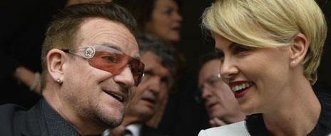 Bono with Charlize Theron