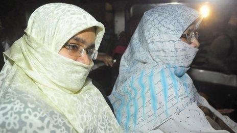 Relatives of Islamist leader Abdul Kader Mullah sit in a vehicle leaving Dhaka Central Jail (December 12, 2013)