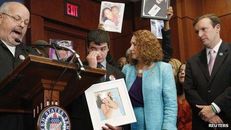 Elizabeth Esty (second from right) consoled the brother of Victoria Soto, who was killed in the mass shooting in Newtown, on Washington DC on 18 September