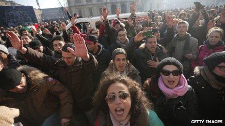 People at a protest against austerity measures in Piazza Castello, Turin, on 11 December