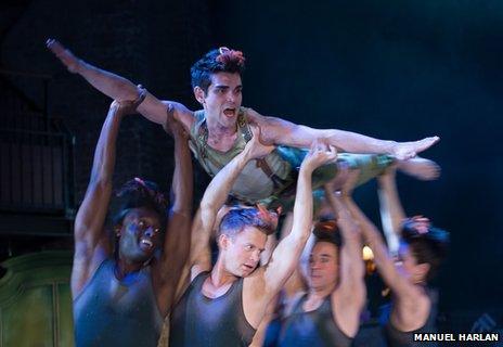 Sam Swann (Peter Pan), held by the Shadows (first 2 from L-R - Arthur Kyeyune, Simon Carroll-Jones)