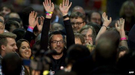 Volunteer SPD vote-counters cheer after results referendum on whether to enter into a grand coalition with its political rivals are announced