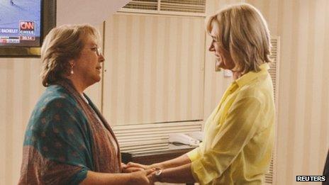 Evelyn Matthei (right) greets president-elect Michelle Bachelet after conceding defeat in the second round of the presidential election on 15 December, 2013