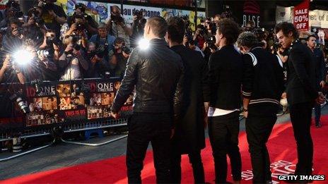 One Direction pose for accredited photographers at the premiere of their film This Is Us in August