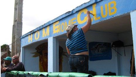 Woman painting the lettering