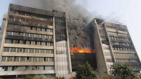 Smoke rises from the fire at the Standard Group garment factory in Gazipur