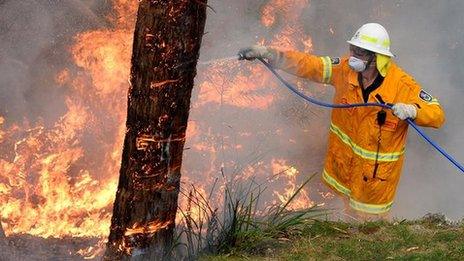 firefighter tackling blaze