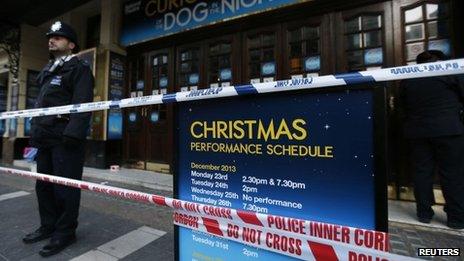 A police officer on duty outside the Apollo theatre on Friday