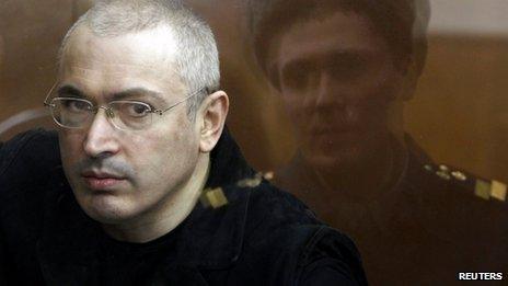 Jailed Russian former oil tycoon Mikhail Khodorkovsky is seen standing in the defendants" cage during a court session in Moscow in this April 5, 2010 file photograph.