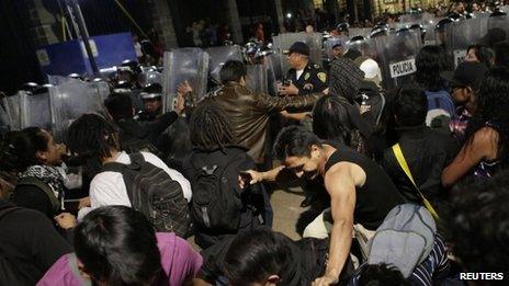 Police block protesters from Zocalo Square, Mexico City. 20 Dec 2013