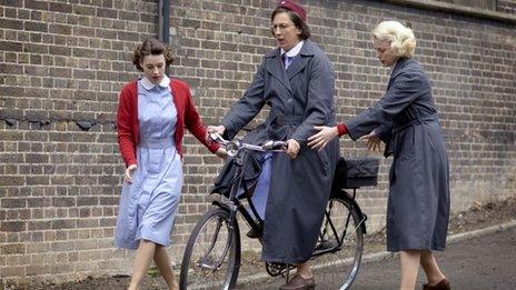 Miranda Hart rides a bicycle in the TV programme Call the Midwife