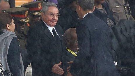 Raul Castro shakes Obama's hand, 10 Dec 13, Mandela memorial