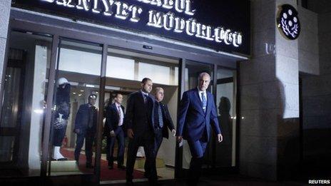 Istanbul police chief Huseyin Capkin (front) leaves the police headquarters in Istanbul (18 December 2013)