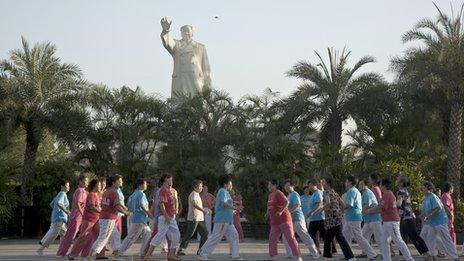 People dancing and exercising in front of a Mao statue Shijiazhuang City, Hebei Province, August, 2009.