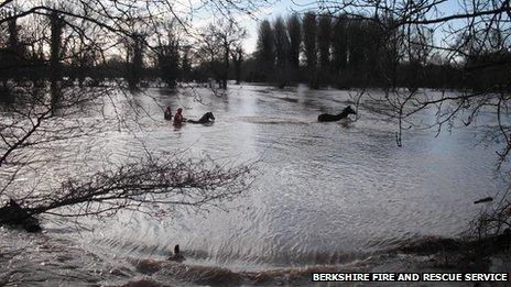 Rescuing horses from a flooded field in Sulhampstead, near Reading