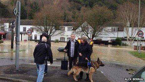 people by road in flooding