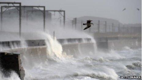 Waves crash over a wall near Saltcoats station on December 24 2013