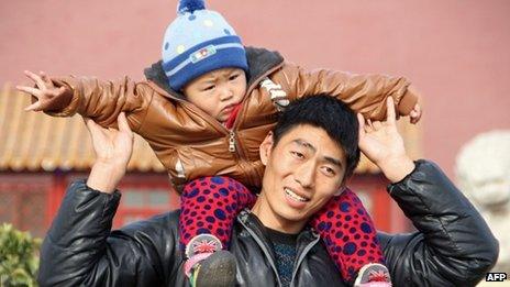 Father and son on visit to Tiananmen Square in Beijing - 5 December