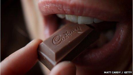 Woman eating Cadbury's chocolate