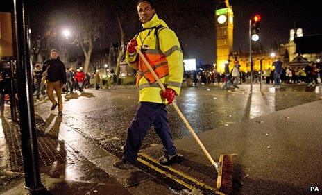 A road sweeper begins clearing up after London's new year celebrations