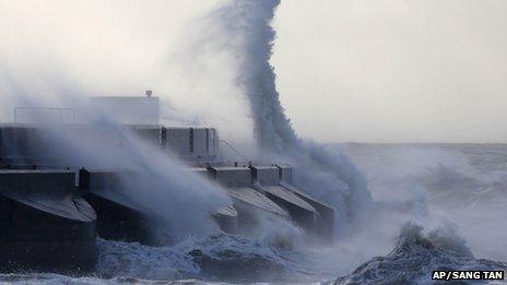 Waves batter into the sea wall of a marina in Brighton on 28 October 2013