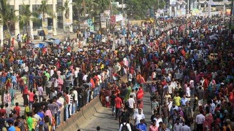 Bangladeshi garment workers block a street during a protest in Gazipur, 40 kilometers (25 miles) north of Dhaka, Bangladesh, Monday, Sept. 23, 2013.