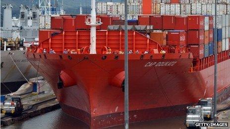 A container ship passes through a lock at the Panama Canal