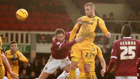 Harry Worley heads Newport County level against Northampton
