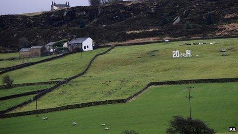 2014 sign in a Keighley field